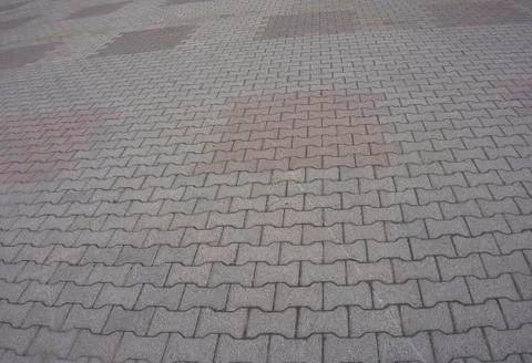 Texture of gray and yellow patterned paving tiles on the ground of street, pe Stock Photos
