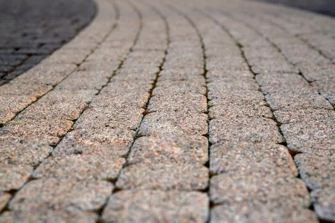 Texture of gray and yellow patterned paving tiles on the ground of street, pe Stock Photos