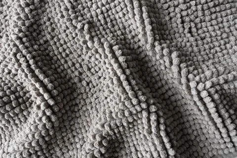 Texture of a gray blanket made of small balls Stock Photos