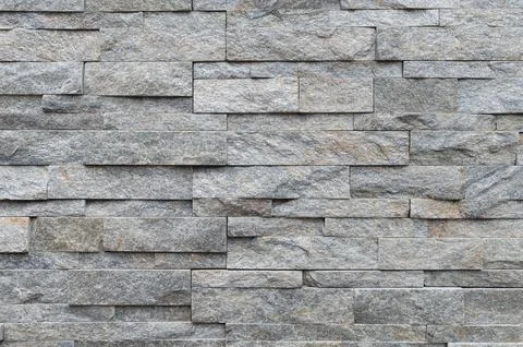 Texture of gray brick slate stone wall surface Stock Photos