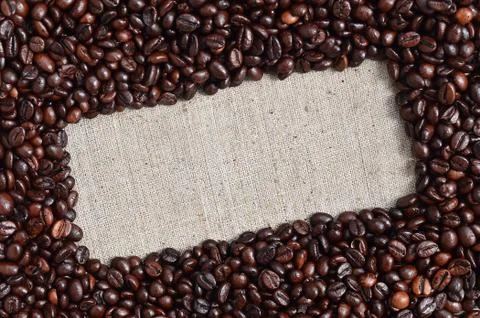 Texture of a gray canvas made of old and coarse burlap with coffee beans on i Stock Photos