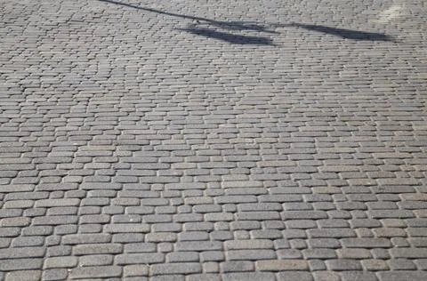 Texture of the gray cobblestone for sidewalk Stock Photos