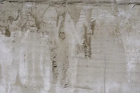 The texture of a gray concrete wall. The background of old cement plaster. Gr Stock Photos