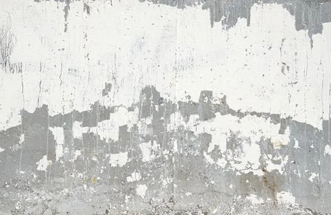 The texture of a gray concrete wall with white spots. Stock Photos