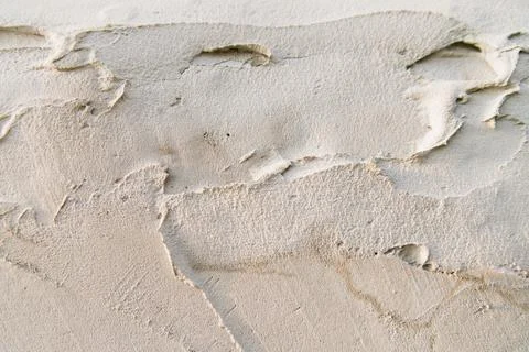 The texture of a gray concrete wall.Background of rough smears of cement on t Stock Photos