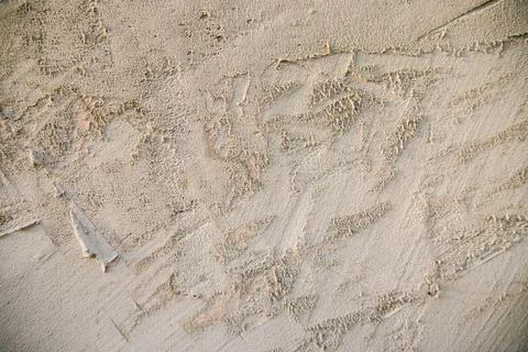 The texture of a gray concrete wall.Background of rough smears of cement on t Stock Photos
