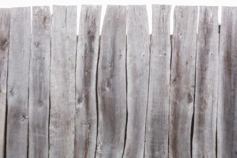 Texture of a gray curve fence from old boards Stock Photos