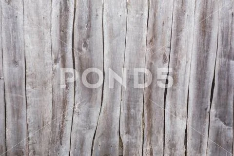 Texture of a gray curve fence from old boards Stock Photos