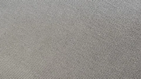 Texture of gray dense fabric close-up with a pronounced diagonal weave of Stock Photos