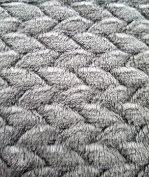 Texture of gray fabric with woven pattern seen close up showing soft fibers.. Fotos Stock
