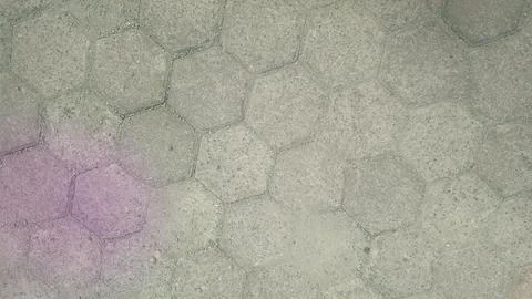 Texture of Gray Hexagonal Paving Blocks with Purple Dust Stain Background Fotos de archivo