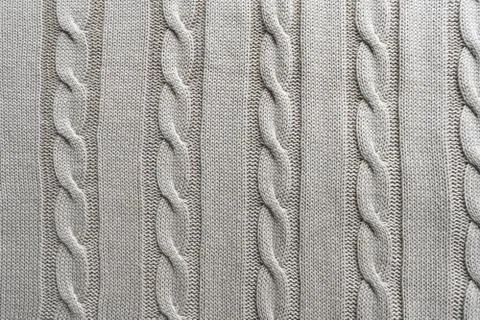 Texture gray knitted fabric with a pattern Stock Photos