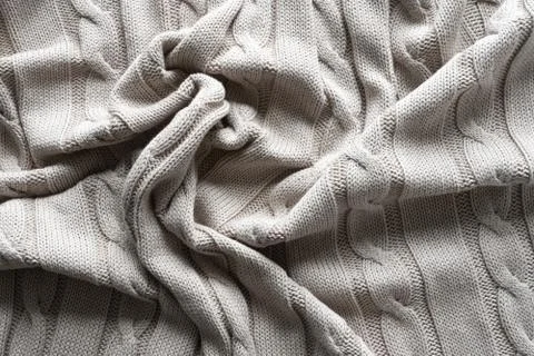 Texture gray knitted fabric with a pattern Stock Photos