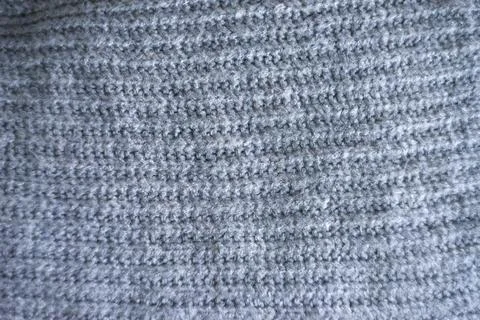 Texture gray knitted fabric with a pattern Stock Photos