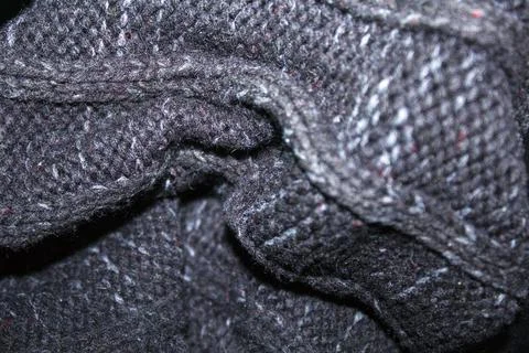 Texture gray knitted fabric with a pattern Stock Photos