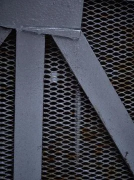 Texture of a gray metal grate with various elements Fotos de archivo