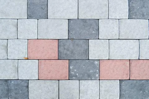 Texture of gray rectangular concrete stone paving slabs on the road with seam 스톡 사진