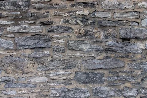 Texture of gray stone wall background Stock Photos