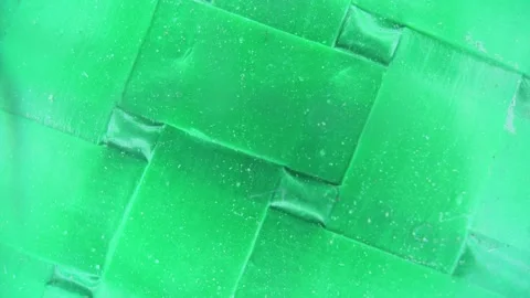 Texture of green artificial burlap, shot under microscope,Dolly shot. Stock Footage 295336870
