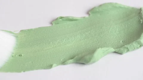 Texture of green clay mask. Swatch of clay mask. Makeup brush applying gree.. Stock Footage 263109162