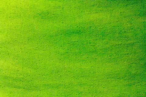 Texture of green fabric made of polyester Stock Photos