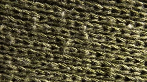 The texture of green natural wool on a warm sweater. Macro video slider Stock Footage 152853484