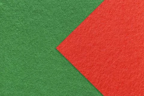Texture of green paper background, half two colors with red arrow, macro. Stock-Fotos