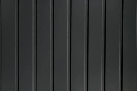 Texture of grey metal profiled sheet fence decking. Illustrazione stock