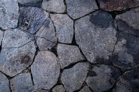 Texture of half wet gray rocks create a beautiful natural pattern for exotic  Stock Photos