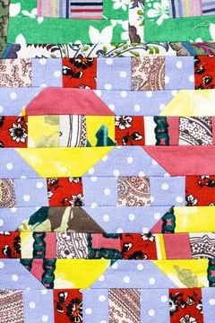 Texture of handcrafted patchwork quilt close-up Stock Photos