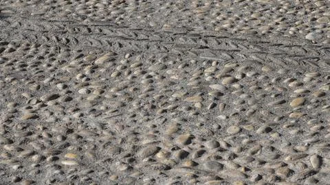 Texture of a handmade paving made of river pebbles Stock Photos