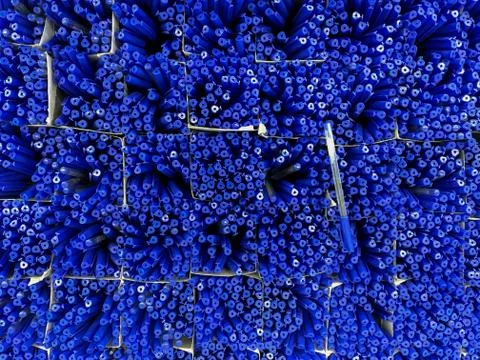 The texture of the huge number of the same blue handles. Stationery. Photos