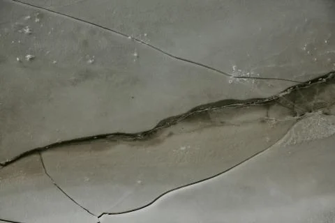 Texture of ice on the river, broken into cracks, Stock Photos