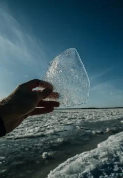 Texture of ice on the river, broken into cracks, Stock Photos
