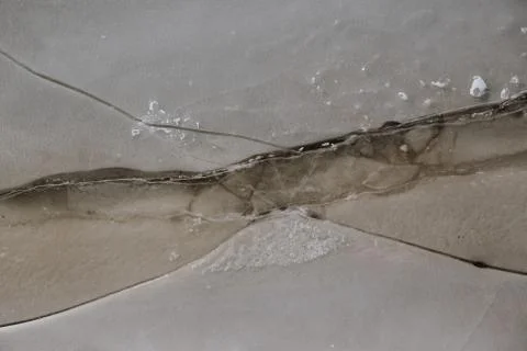 Texture of ice on the river, broken into cracks, Stock Photos