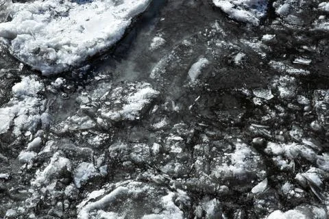 Texture of ice on the river, broken into cracks, Stock Photos