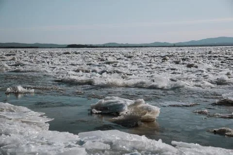 Texture of ice on the river, broken into cracks, Stock Photos