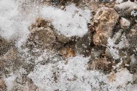 Texture of ice on the river, broken into cracks, Stock Photos