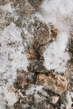Texture of ice on the river, broken into cracks, Stock Photos