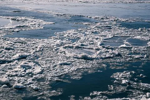 Texture of ice on the river, broken into cracks, Stock Photos
