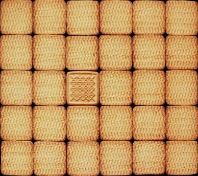 Texture from identical pastry with single unique Stock Photos