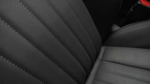 The texture of the interior trim of the car. Car seat design Stock Footage 268162180