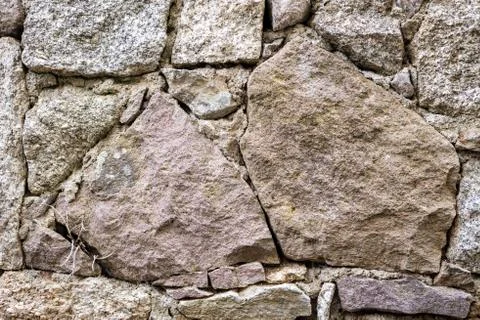 Texture of an irregular stone wall. Background. Stock Photos
