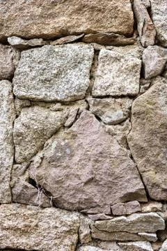 Texture of an irregular stone wall. Background. Stock Photos