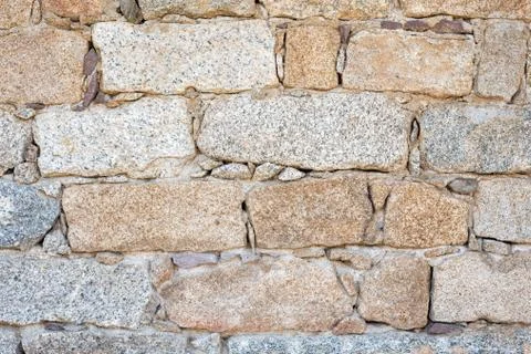Texture of an irregular stone wall. Background. Stock Photos