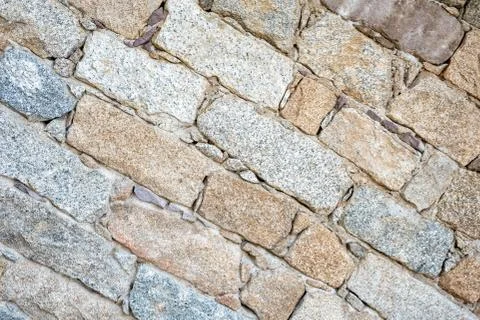 Texture of an irregular stone wall. Background. Stock Photos