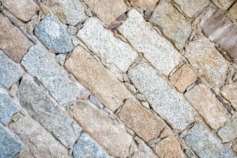Texture of an irregular stone wall. Background. Stock Photos