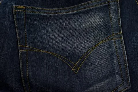 Texture of jeans pocket close up, background. Stock Photos