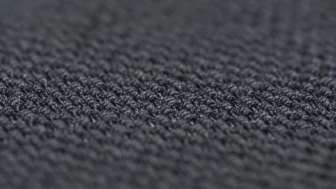 Texture of the knitted fabric is boucle dark gray. close up rotation, macro. Stock-Footage 257736906