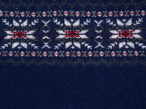 Texture of knitted fabric with ethno pattern. Stock Photos